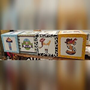 Nwt 4 1ft by 1ft cardboard boxes that spell toys